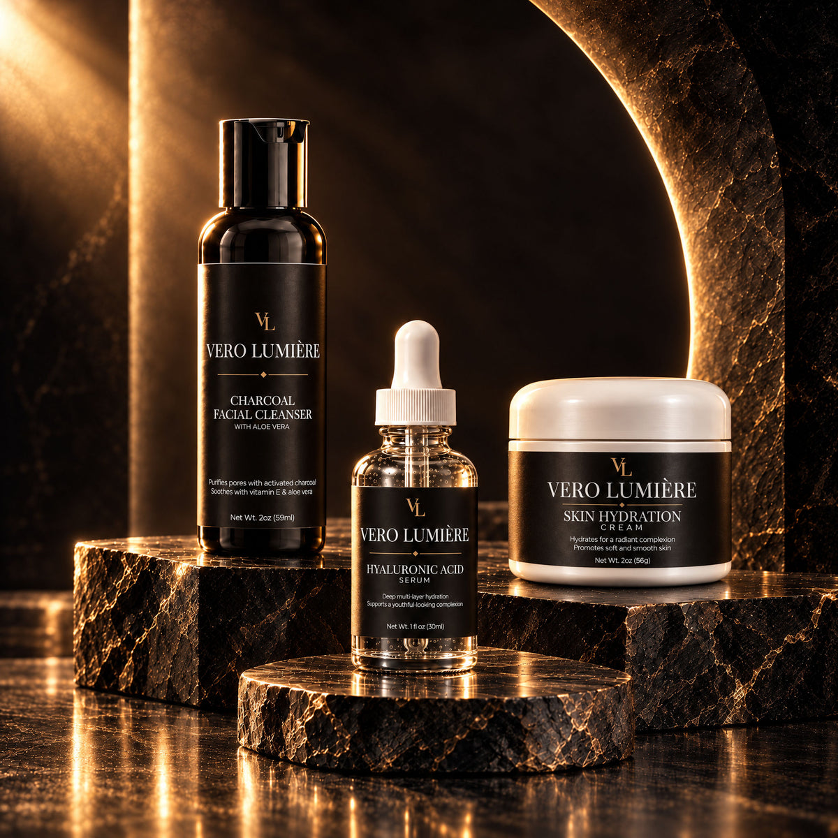 Vero Lumière Charcoal Facial Cleanser, Hyaluronic Acid Serum, and Skin Hydration Cream arranged in a luxury editorial still life representing the Cleanse, Treat, Hydrate ritual.